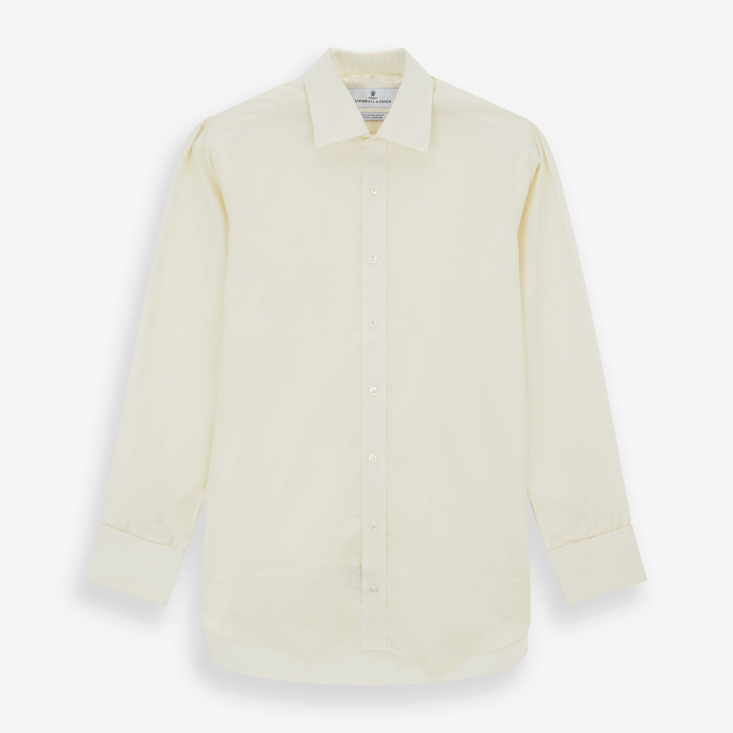 View 1 of product The Tomorrow Never Dies Cream Cotton Hamburg Shirt by Turnbull & Asser is a classic, cream-colored, long-sleeved button-up with a traditional collar and buttoned cuffs—just like the one worn by James Bond.
