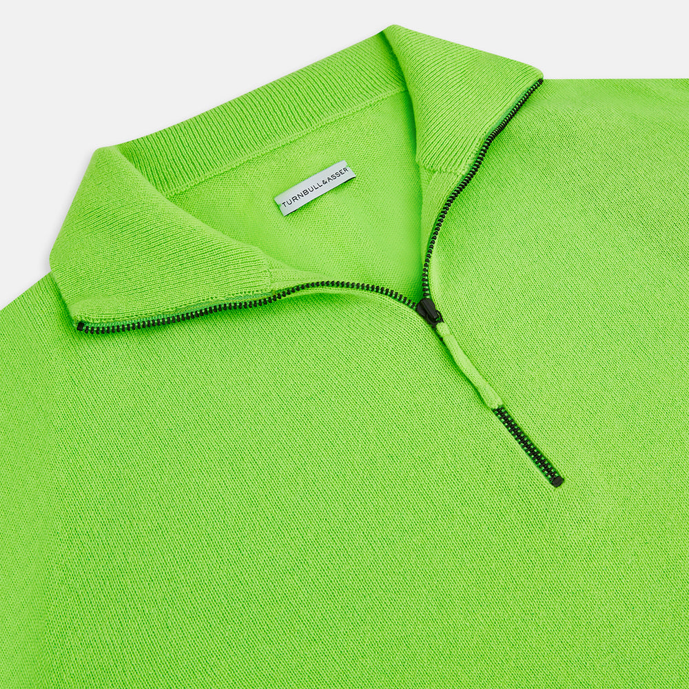 The Turnbull & Asser Neon Green Half-Zip Cashmere Jumper features long sleeves, a high collar, and front half-zip closure—ideal knitwear for bold style, shown on a white background.