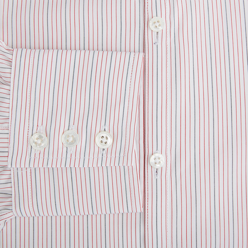 The Red Hairline Stripe Westminster Shirt by Turnbull & Asser features a pointed collar and thin vertical stripes in a light hue, displayed flat against a white background—a fine example of British craftsmanship.
