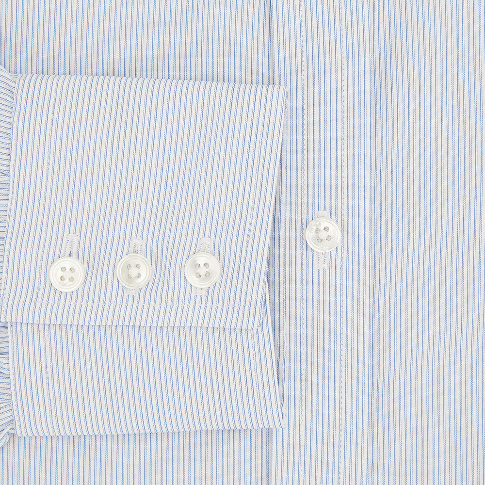 The Sky Blue Hairline Multi Stripe Mayfair Shirt by Turnbull & Asser, made from Italian cotton with a classic collar, white buttons, and buttoned cuffs, is displayed on a plain white background—an essential for any gentleman.