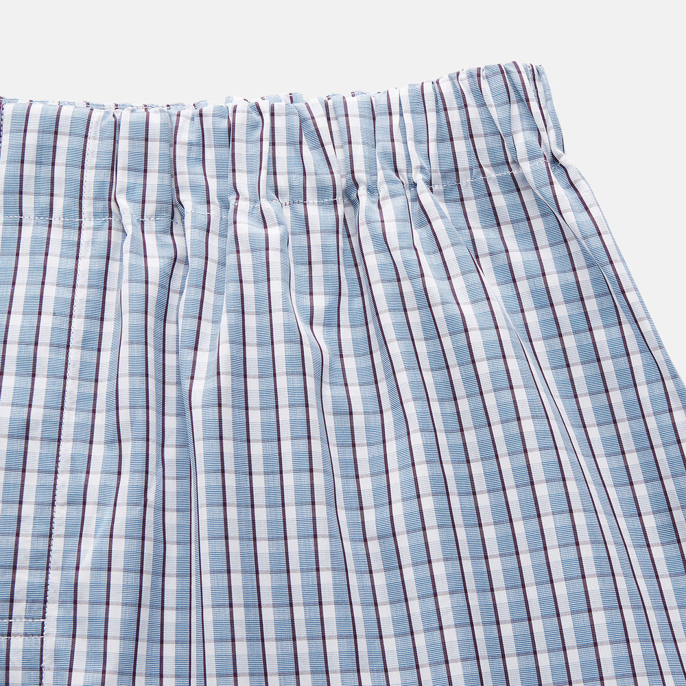 The Blue and White Check Cotton Hastings Pyjama Trousers by Turnbull & Asser feature an elasticated drawstring waist and a relaxed, straight-leg contemporary fit, shown against a white background for comfortable lounging.
