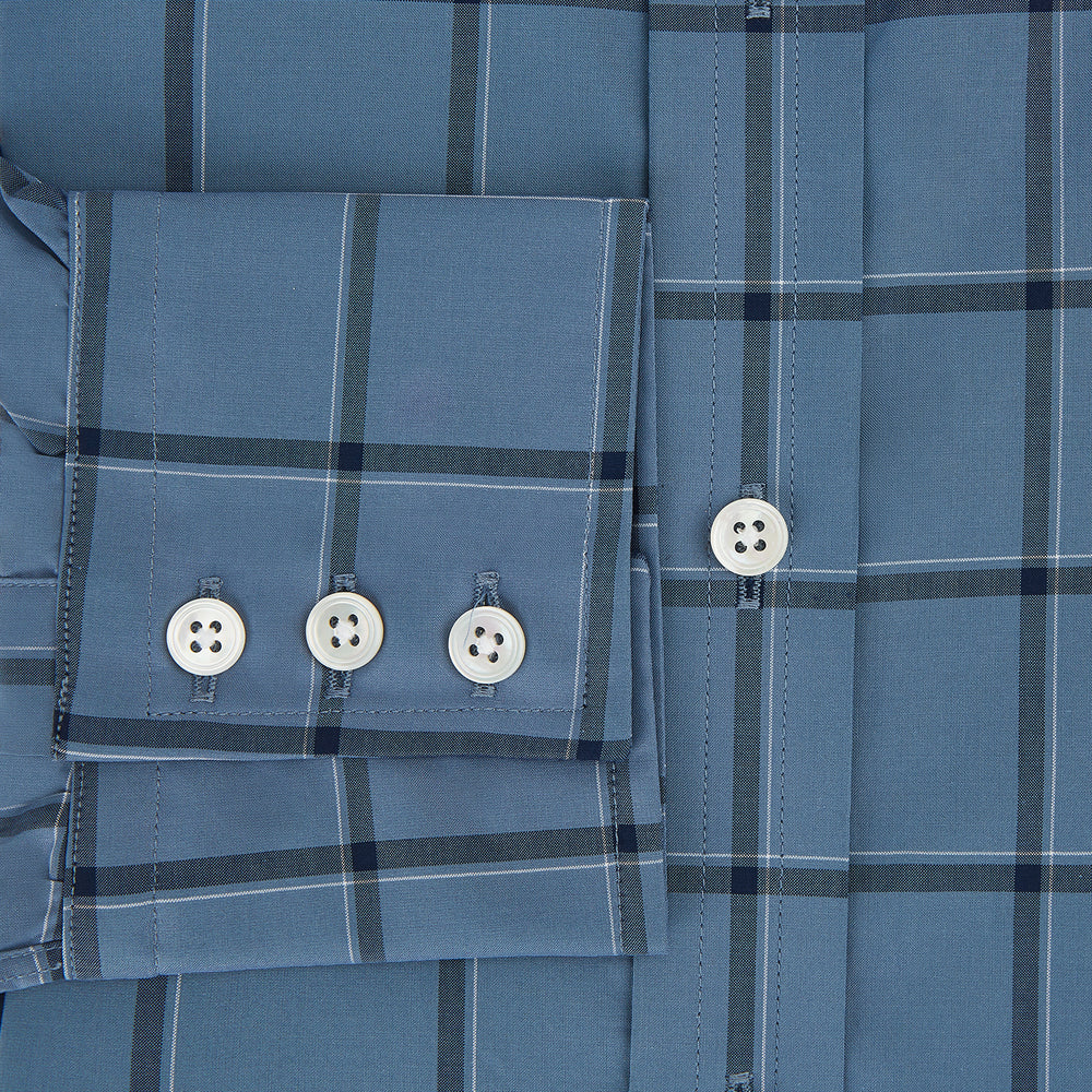 The Turnbull & Asser Steel Grey Grid Check Mayfair Shirt is a long-sleeve, button-up shirt in light blue Italian cotton, shown against a plain white background.
