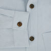 View 4 of product The Turnbull & Asser Grey Hyde Overshirt is a long-sleeve button-up made from sanforised cotton, featuring a single chest pocket and dark buttons, shown against a plain white background.