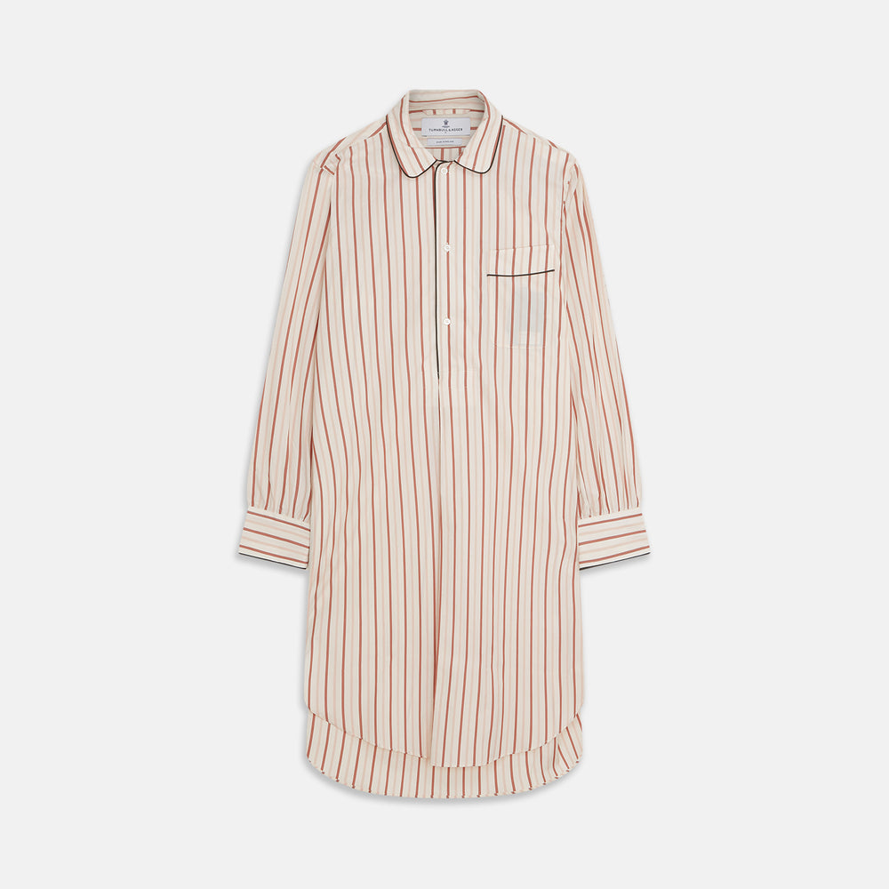 The Burgundy Multi Striped Cotton Sussex Nightshirt by Turnbull & Asser features long sleeves, knee length, a pointed collar, chest pocket, burgundy and beige stripes on white, buttoned cuffs, and a curved hem for classic sleepwear style.