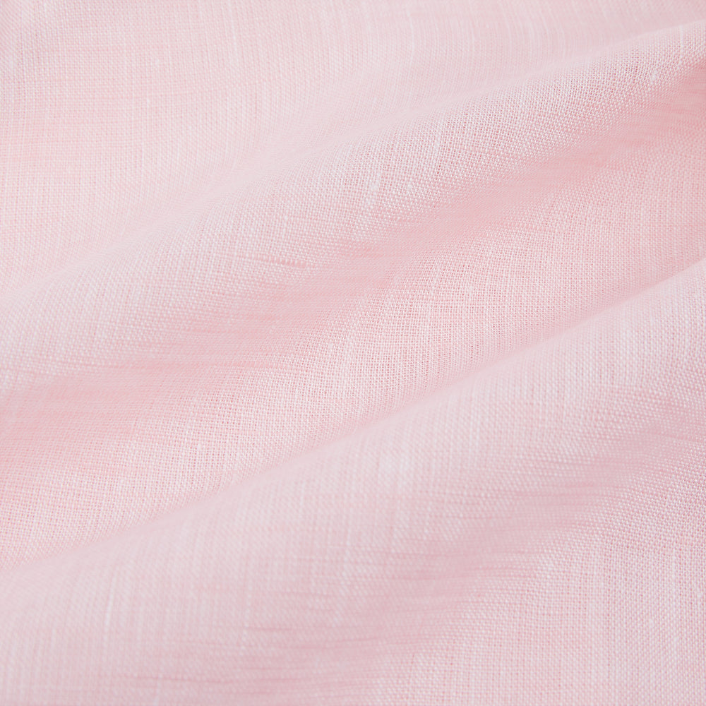 The Turnbull & Asser Pale Pink Linen Mayfair Shirt features a classic, formal style with long sleeves, a collar, and white buttons. Shown laid flat on a white background.