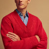 View 3 of product The Turnbull & Asser Raspberry Red Cashmere Edwards V-Neck Sweater features long sleeves, ribbed cuffs and hem, and is shown laid flat on a white background.