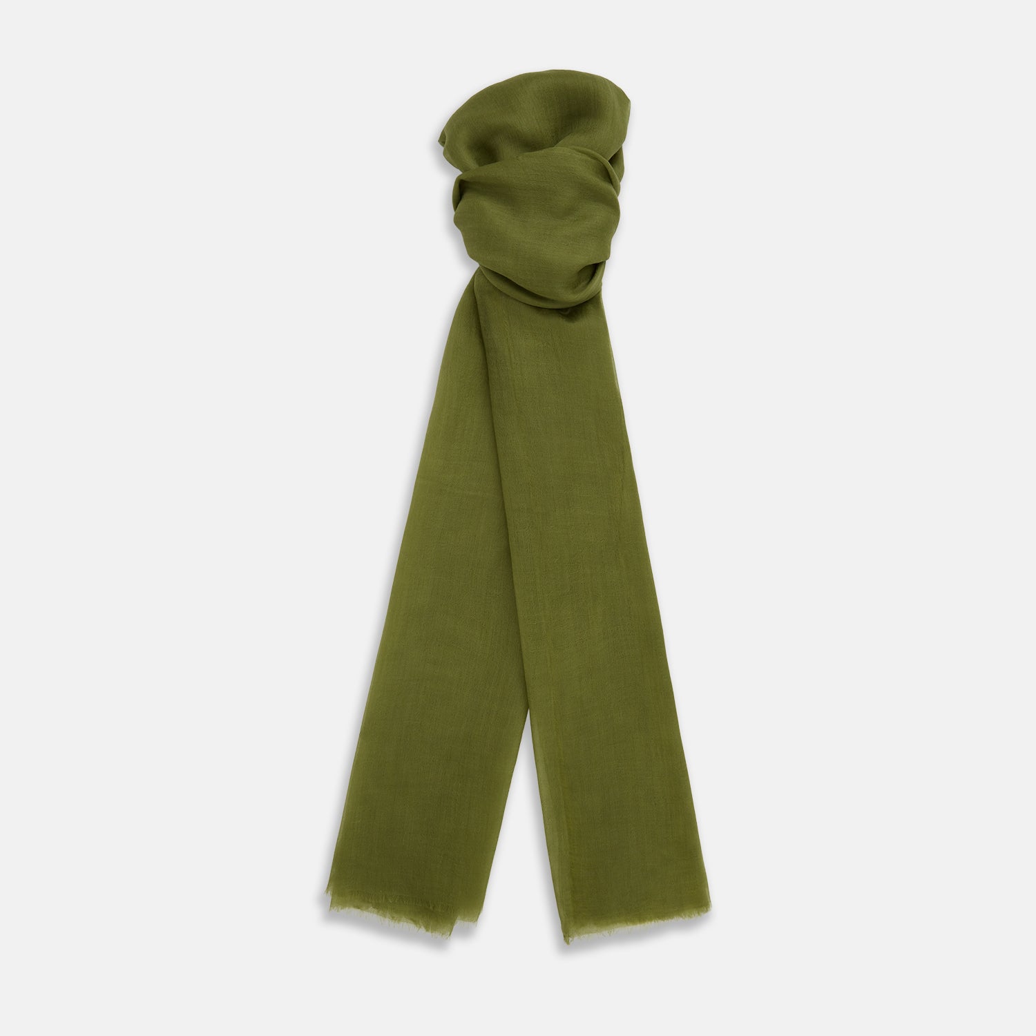 View 1 of product The Moss Green Cashmere Scarf by Turnbull & Asser features a lightweight, slightly sheer texture with subtle unfinished fringe ends. Loosely folded and draping elegantly, it’s a true luxury accessory set against a plain white background.