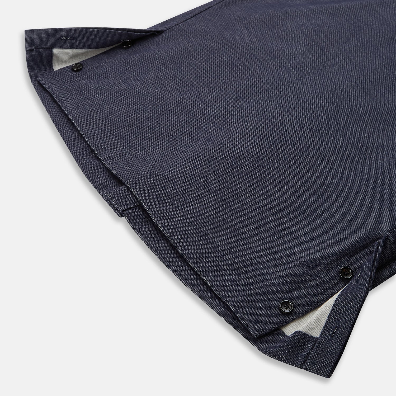View 5 of product The Turnbull & Asser Navy Hampstead Overshirt features a collar, left chest pocket, two zippered pockets near the bottom, and a classic long-sleeve button-up design, shown laid flat on a white background.