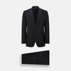 View 1 of product The Turnbull & Asser Black Single Breasted Dinner Suit features fine wool, a satin shawl collar jacket, and matching trousers—perfect formal wear, shown on a plain white background.