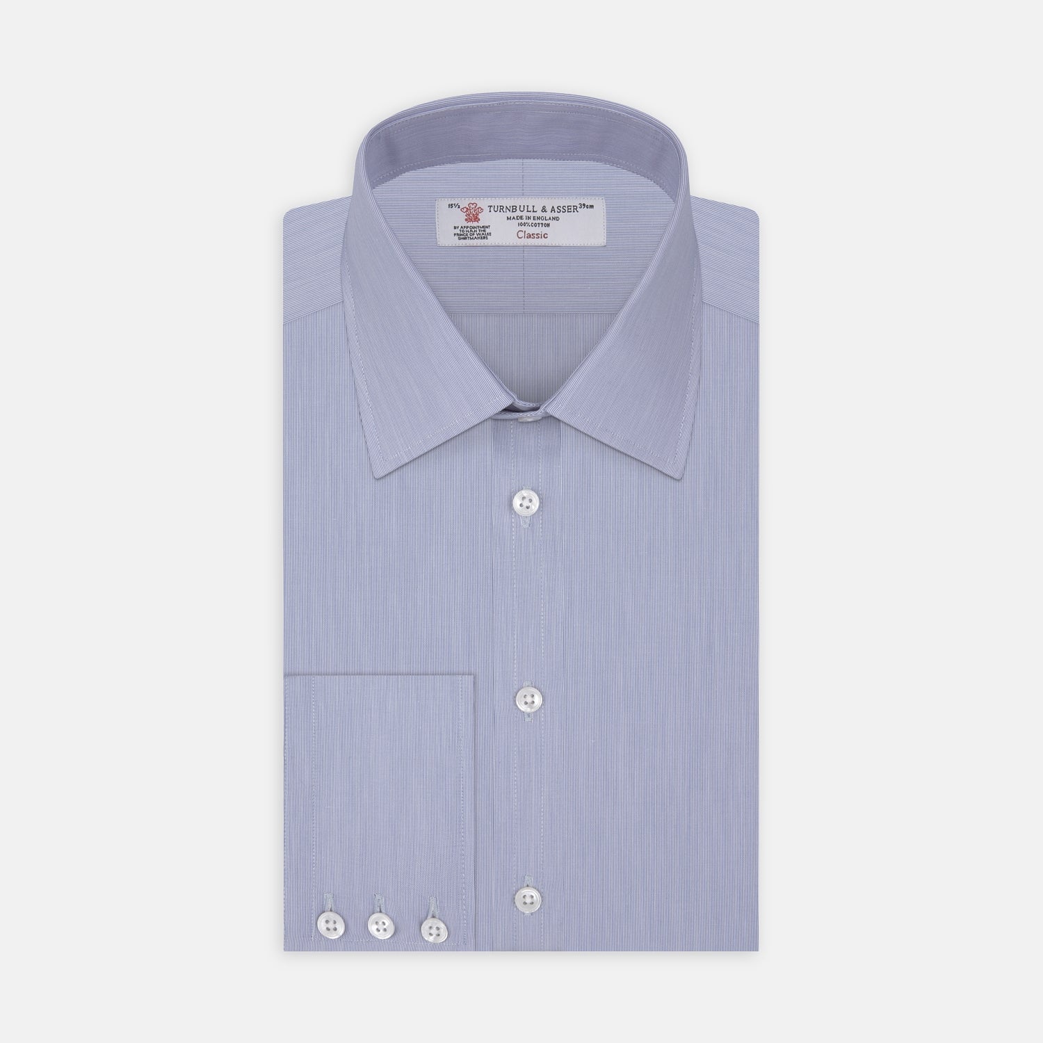 View 1 of product The Turnbull & Asser Blue Hairline Stripe Shirt features a T&A collar, 3-button cuffs, and subtle stripes, displayed neatly folded against a plain white background.