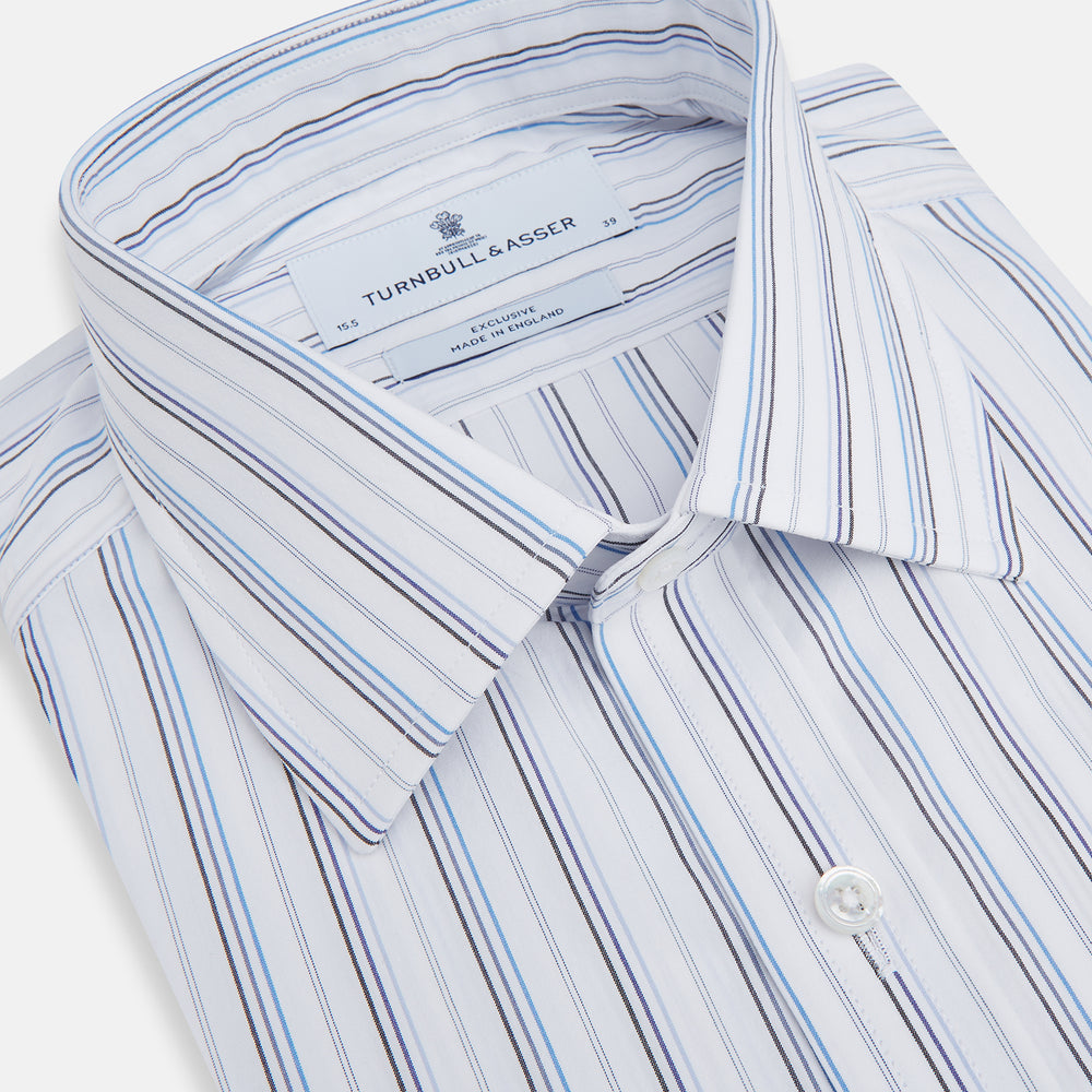 The Turnbull & Asser Blue Fine Multi Pinstripe Mayfair Shirt features long sleeves, an organic cotton build, a T&A collar, and vertical blue stripes. Laid neatly on a white background.