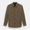 View 1 of product The Pine Cone Linen Holland Shacket by Turnbull & Asser is a brown men's lightweight outerwear piece with a collar, long sleeves, three front zip pockets, and black buttons, shown on a white background.