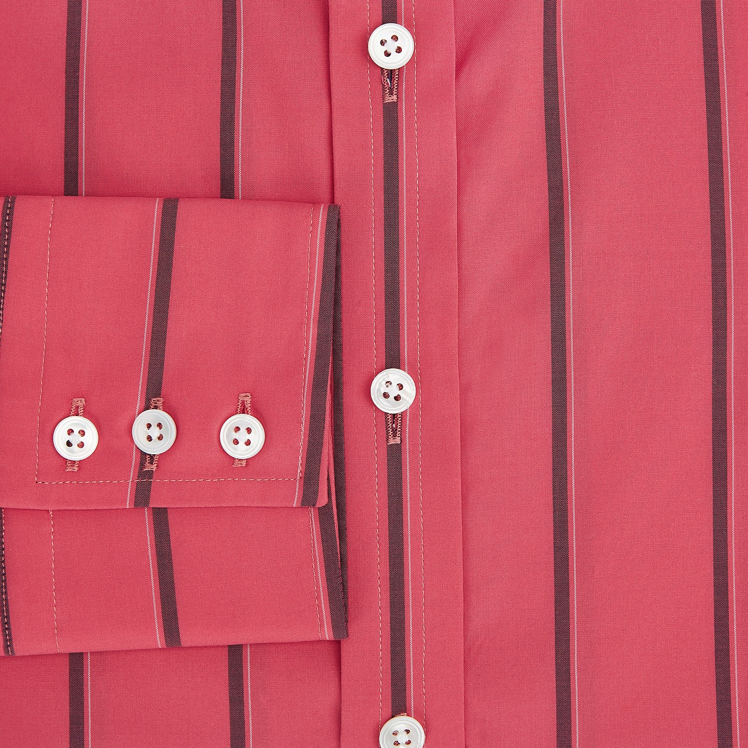 View 4 of product The Coral Red Track Stripe Mayfair Shirt by Turnbull & Asser features long sleeves, button-up front, a classic T&A collar, and buttoned cuffs in vibrant Italian cotton with vertical black pinstripes, shown on a plain white background.