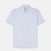 View 2 of product A circular swatch of Turnbull & Asser's Pale Blue Stripe Cotton Fabric, featuring subtle white vertical pinstripes on light blue, is shown against a white background with a gray-bordered circle.