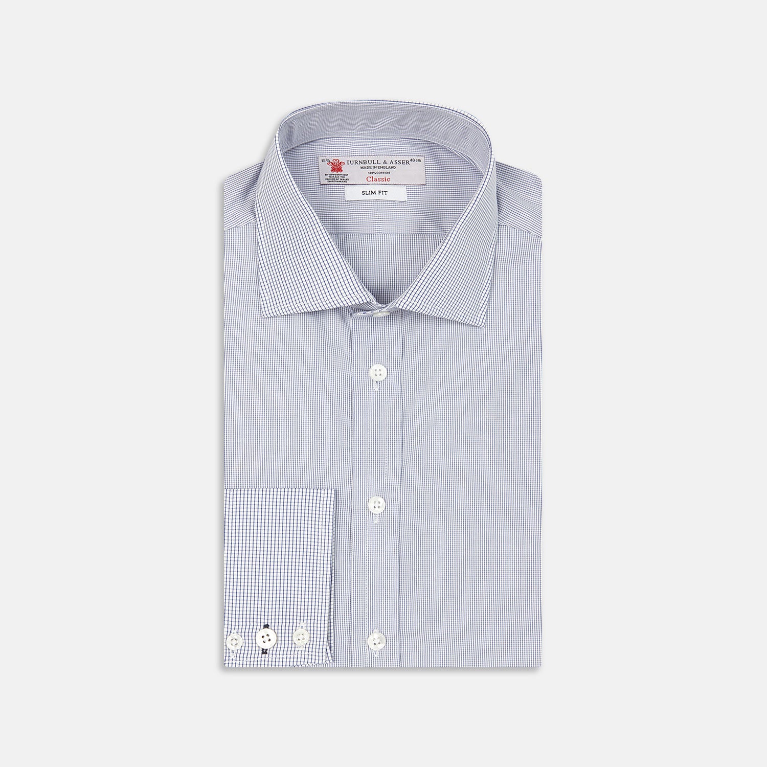 View 1 of product The Turnbull & Asser Slim Fit Blue Checked Shirt features long sleeves, contrasting white buttons, a regent collar, and distinct blue check pattern detailing on the cuff.