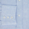 View 4 of product The Turnbull & Asser Pale Blue Linen Mayfair Shirt features a collar, front pocket, and white buttons. This long-sleeve shirt is displayed on a white background.