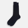 View 2 of product A single Navy Thick Knit Mid-Length Sock by Turnbull & Asser is shown in side profile against a plain white background, with the toe pointing left and the cuff at the top.