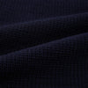 View 6 of product The Turnbull & Asser Navy Greenwich Knitted Overshirt, made from Italian wool with a collar, two front flap pockets, and a hidden button placket, is shown laid flat on a white background.