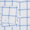 View 4 of product The Turnbull & Asser Colony Blue Grid Check Mayfair Shirt features long sleeves, a button-down front, Italian cotton fabric, a spread collar, and buttoned cuffs, shown against a plain white background.