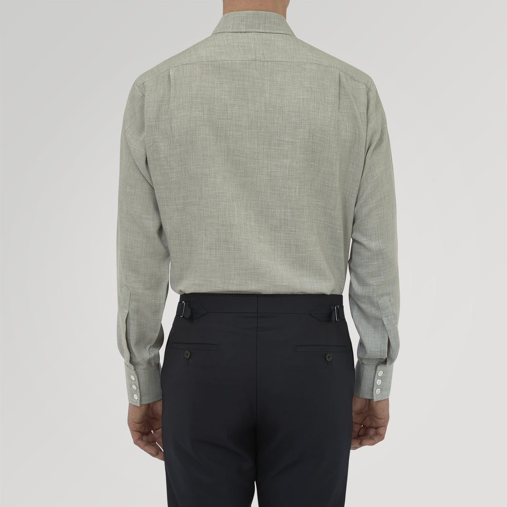 The Turnbull & Asser Grey Cashmere Blend Shirt features a T&A collar, 3-button cuffs, and a front pocket, shown neatly folded with white buttons against a plain white background.