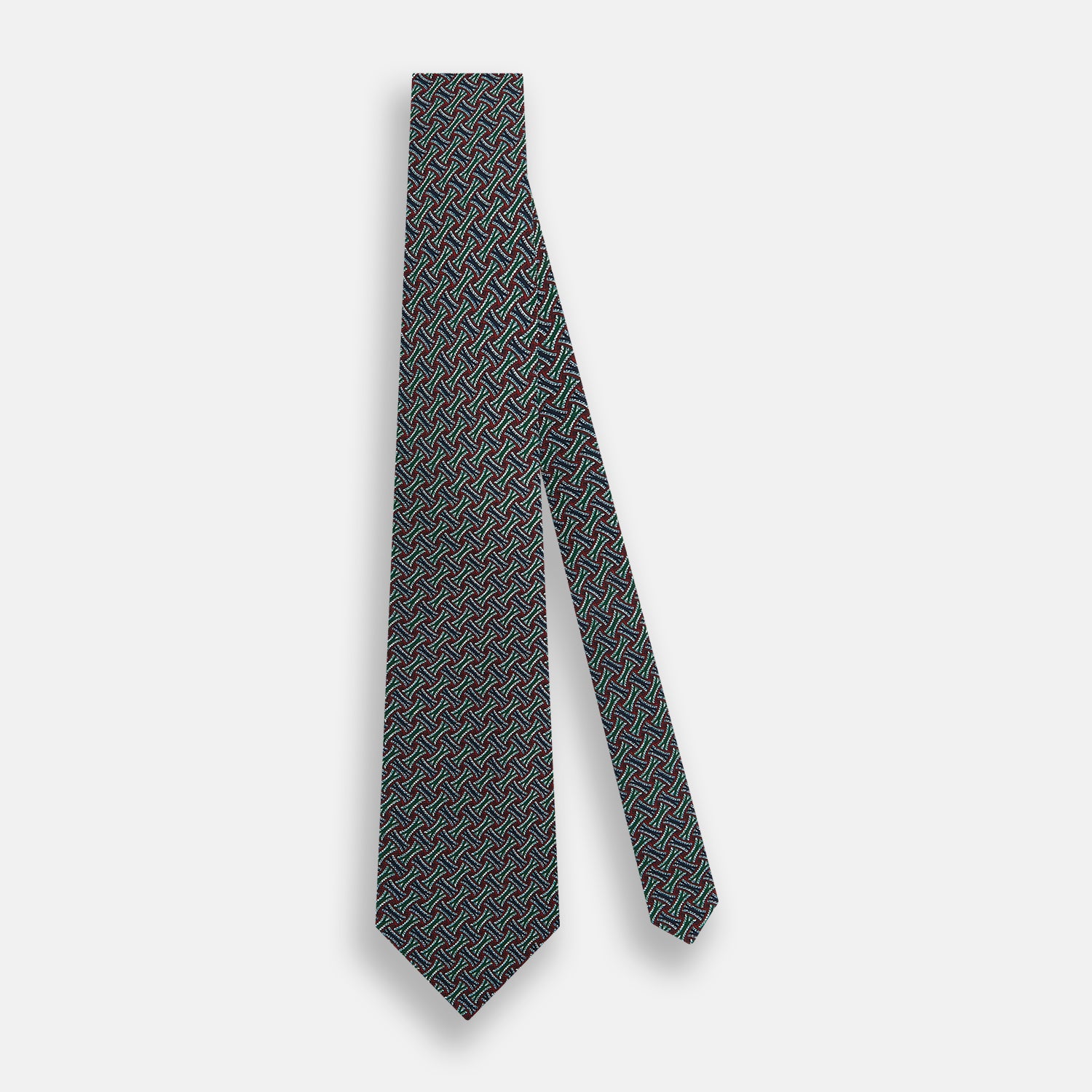 View 2 of product The Forest Green and Red Weave-Patterned Printed Silk Tie by Turnbull & Asser features an intricate geometric motif in red, green, blue, and white, crafted from luxurious English silk for classic sophistication.