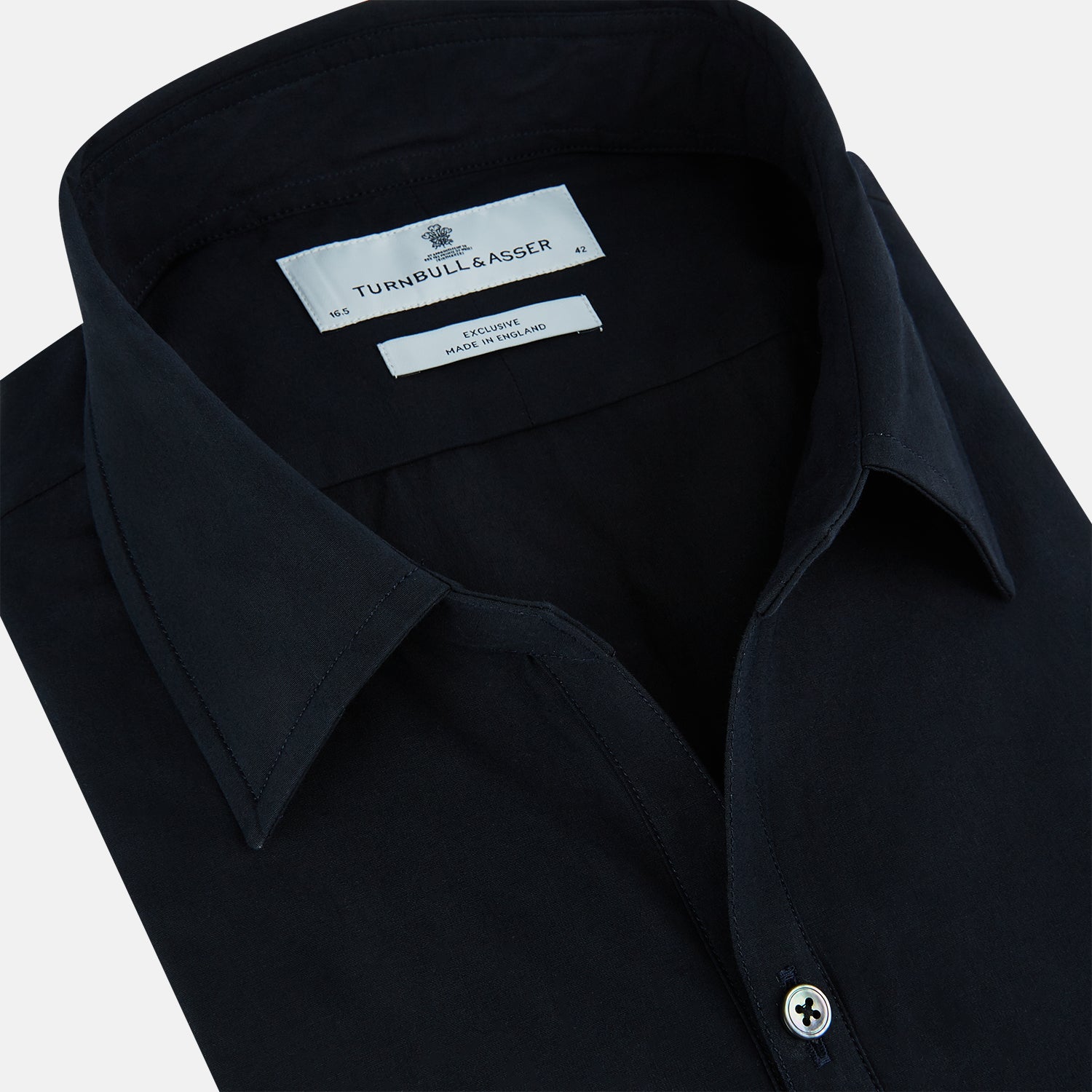 View 2 of product The DARK NAVY WINDSOR SHIRT by Turnbull & Asser is a long-sleeve shirt with a refined Windsor collar, showcasing classic British craftsmanship.