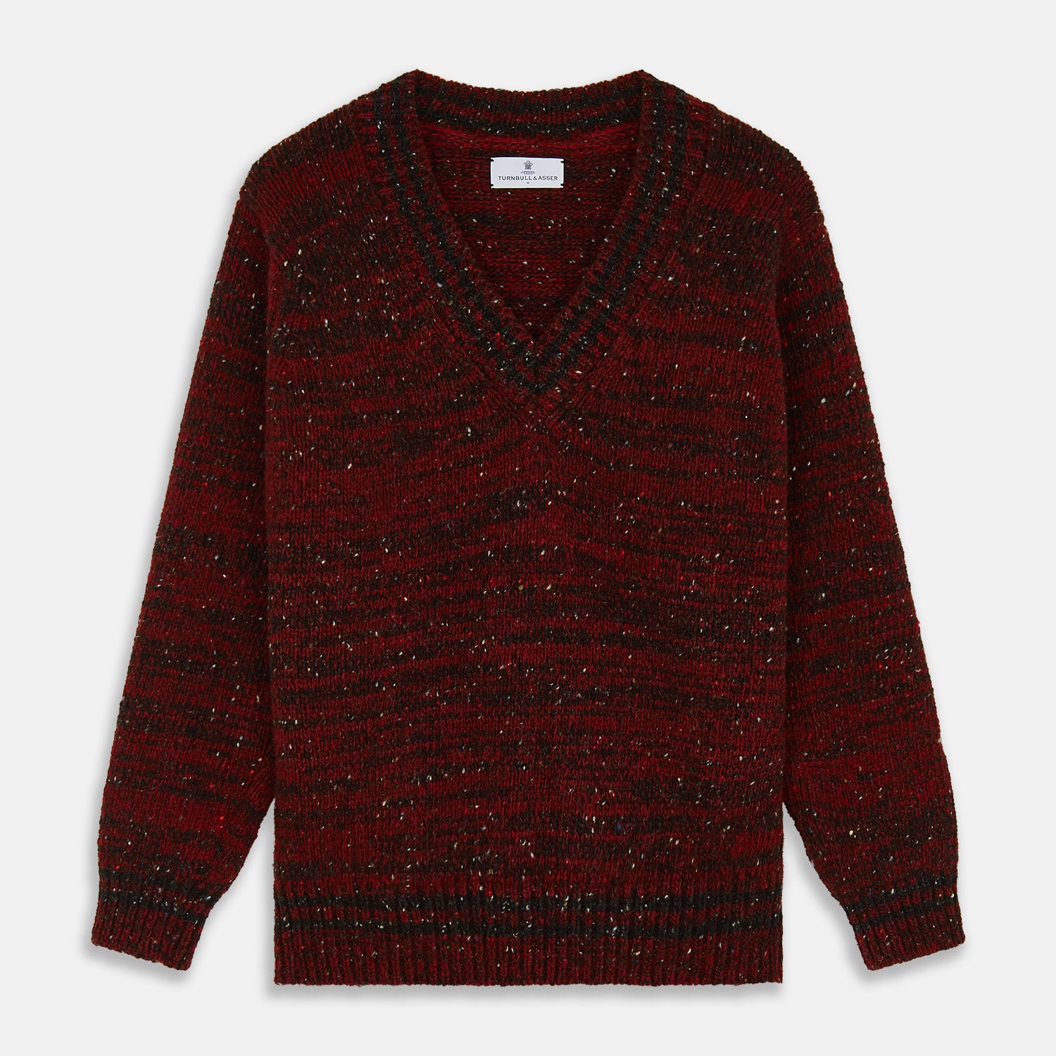View 1 of product The Turnbull & Asser Russet Red Melange Wool Hafod Cricket Jumper features maroon and black speckles, a V-neck, long sleeves, and ribbed cuffs and hem, displayed flat on a white background.