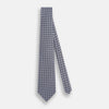 View 2 of product The Turnbull & Asser Navy and Pink Weave-Patterned Printed Silk Tie is shown rolled up on a white background, featuring a stylish geometric design.