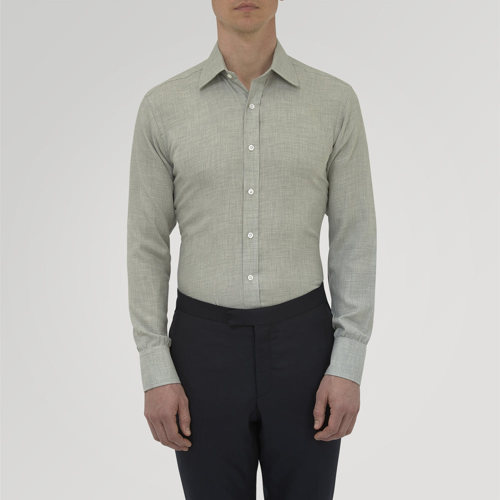 The Turnbull & Asser Grey Cashmere Blend Shirt features a T&A collar, 3-button cuffs, and a front pocket, shown neatly folded with white buttons against a plain white background.
