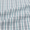 View 6 of product The Turnbull & Asser Sage Green Multi Check Mayfair Shirt is a long-sleeved, button-up shirt with a spread collar, crafted from premium Italian cotton and displayed on a white background.