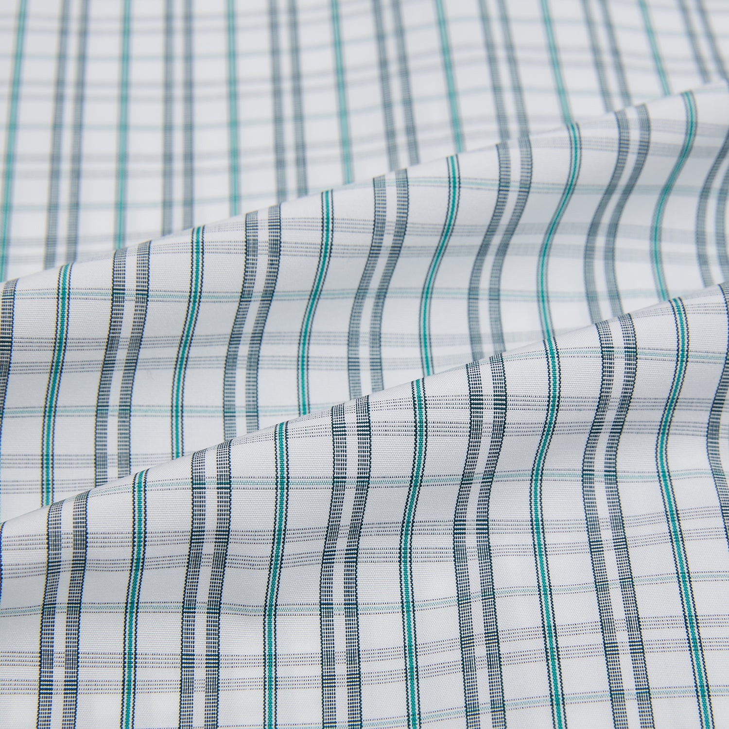 View 6 of product The Turnbull & Asser Sage Green Multi Check Mayfair Shirt is a long-sleeved, button-up shirt with a spread collar, crafted from premium Italian cotton and displayed on a white background.
