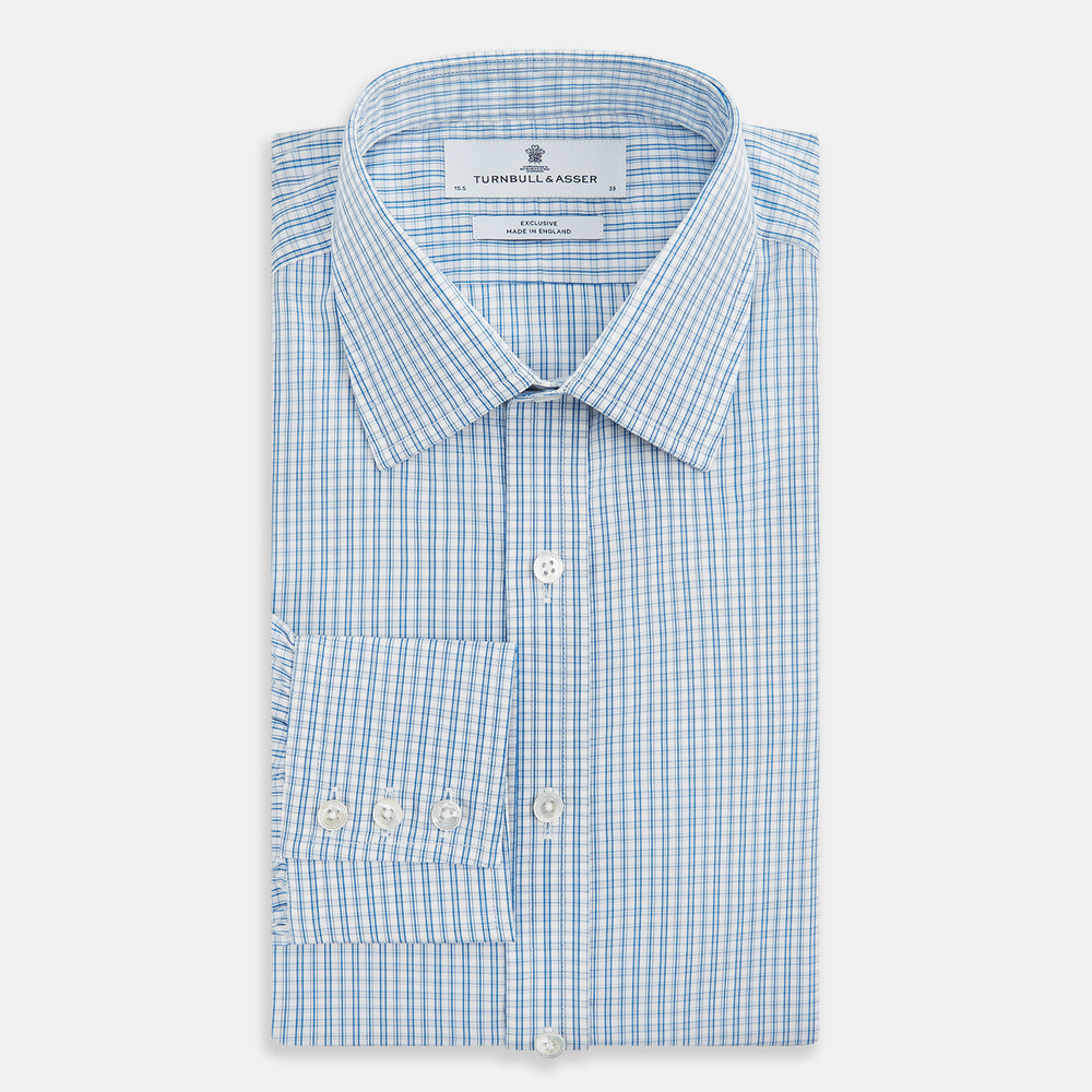 The Sky Blue Micro Graph Check Mayfair Shirt by Turnbull & Asser features a classic T&A collar, button-down front, and buttoned cuffs, shown laid flat on a white background.