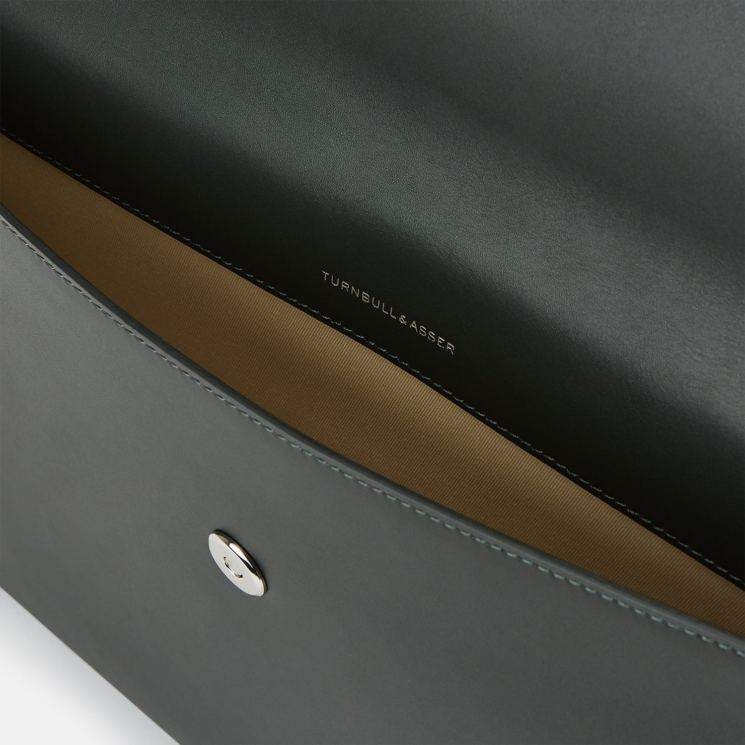 Image 3 of product A stylish, forest green leather snap-fasten pouch by Turnbull & Asser is pictured against a plain white background.