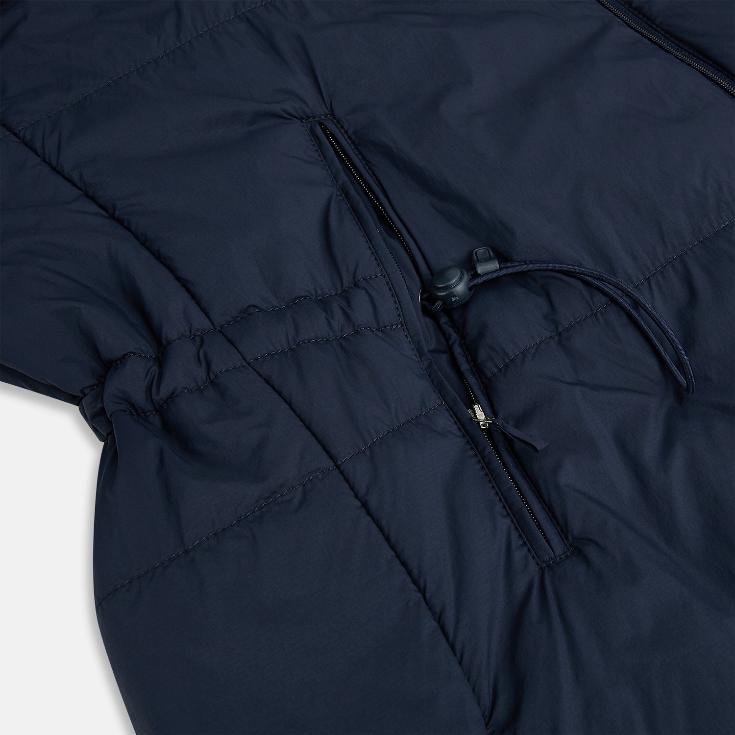 View 8 of product A Navy John Arthur Trench Coat by Turnbull & Asser, featuring a collar, button closure, adjustable cuff straps, two slanted front pockets, and a chest zip pocket, is displayed flat on a white background.