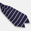 View 3 of product The Turnbull & Asser Silver Stripe and Navy Silk Cravat features two horizontal white stripes on navy silk, offering a sophisticated British-inspired design—ideal as a unique wedding accessory.