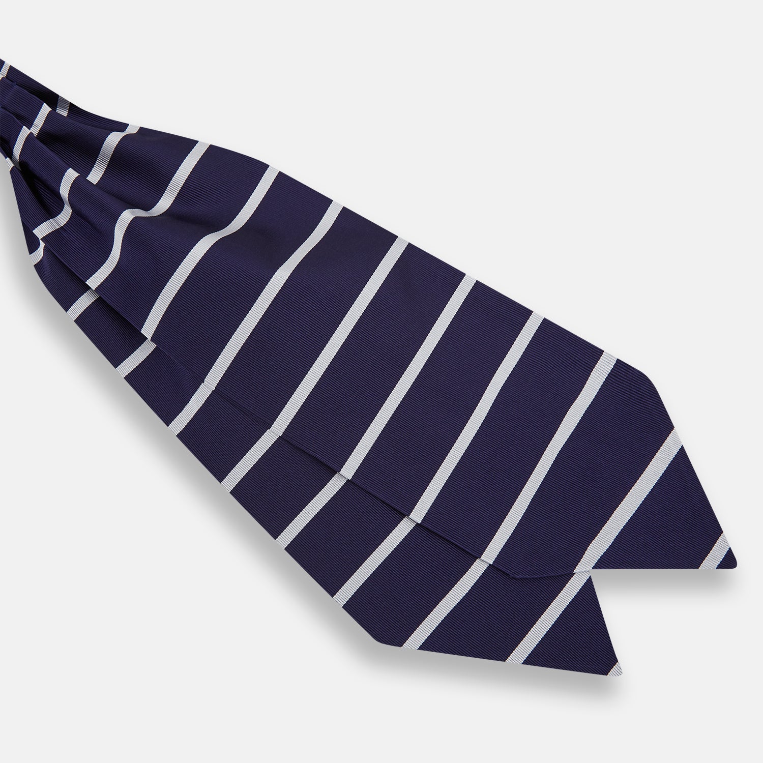 View 3 of product The Turnbull & Asser Silver Stripe and Navy Silk Cravat features two horizontal white stripes on navy silk, offering a sophisticated British-inspired design—ideal as a unique wedding accessory.