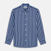 View 2 of product Close-up of Turnbull & Asser’s Navy Wide Stripe Cotton Fabric, showing textured, slightly wavy horizontal stripes in light and dark blue through a circular frame.