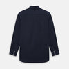 View 3 of product The NAVY BLUE WINDSOR SHIRT by Turnbull & Asser features long sleeves, a classic Windsor collar, white buttons, and buttoned cuffs—highlighting refined British craftsmanship against a plain white background.