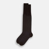 View 2 of product The Turnbull & Asser Dark Chocolate/Pale Blue Polka Dot Long Sock is shown as a single over-the-calf sock with pale blue dots on dark brown, displayed against a plain white background.