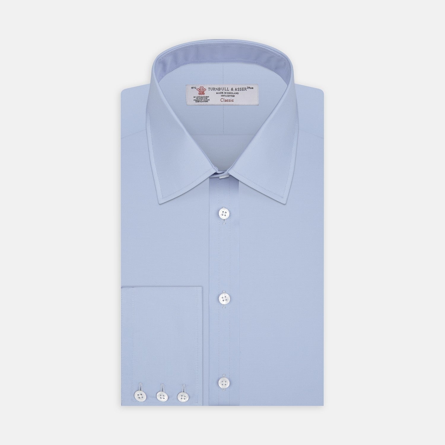 View 2 of product A circular swatch of Turnbull & Asser Blue Cotton Fabric with a subtle texture is shown on a plain white background, outlined by a thin gray border.