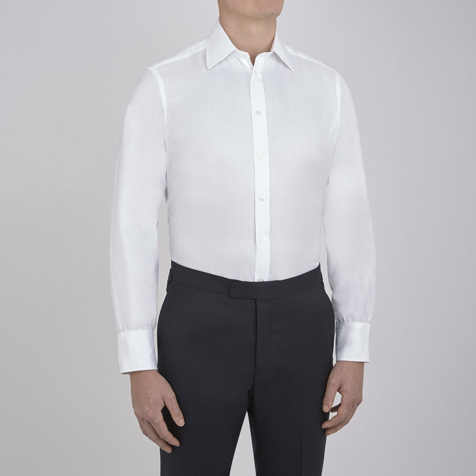 View 4 of product The Turnbull & Asser White Herringbone Superfine Cotton Shirt with T&A collar and 3-button cuffs is perfect for pairing with statement ties or elevating minimalist looks.