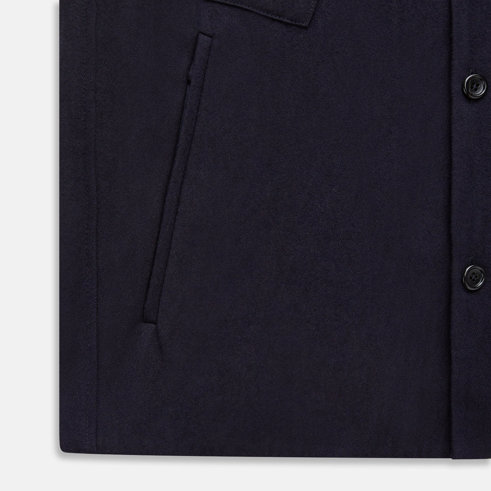 A navy button-up Primrose overshirt by Turnbull & Asser with a classic collar, two side pockets, a left chest pocket, and buttoned cuffs—an ideal blazer alternative, shown on a plain white background.