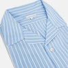 View 2 of product The Turnbull & Asser White and Blue Stripe Quarzo Nightshirt features long sleeves, a collar, button-up front, chest pocket, and mid-length hem—a classic men's striped sleepwear piece.