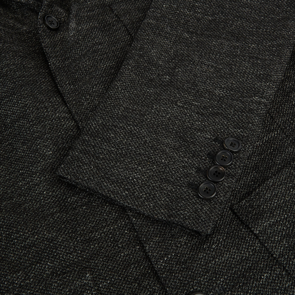 The Charcoal Linen Blend Cambridge blazer by Turnbull & Asser features British tailoring with a notched lapel, two front buttons, and three pockets, shown against a plain white background.