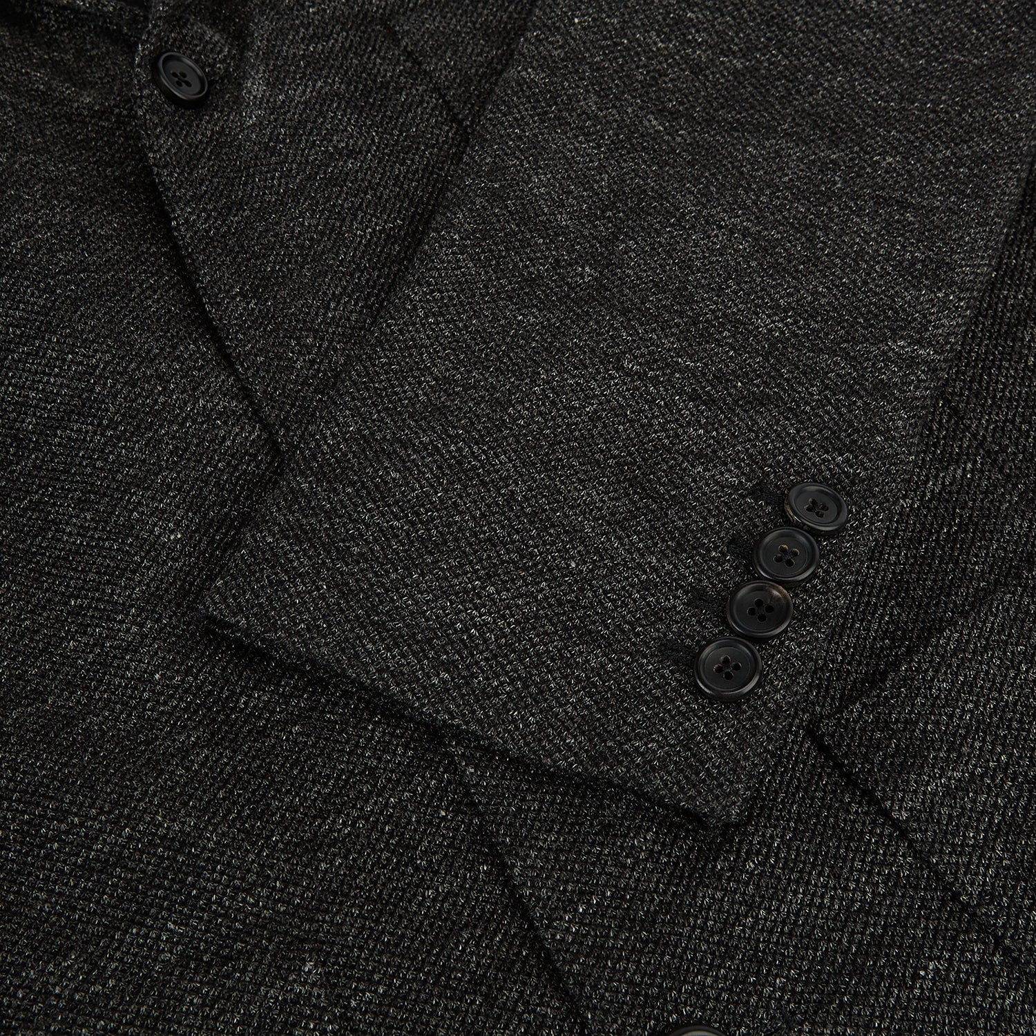 View 4 of product The Charcoal Linen Blend Cambridge blazer by Turnbull & Asser features British tailoring with a notched lapel, two front buttons, and three pockets, shown against a plain white background.