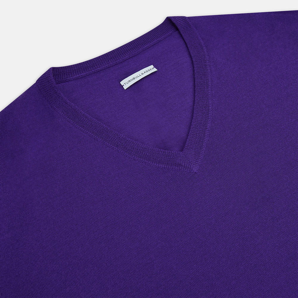 The Turnbull & Asser Purple Merino V-Neck Jumper features long sleeves and a rich, solid hue, making it an essential knitwear piece for any wardrobe.