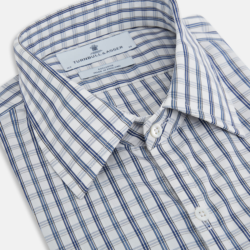 The Azzurro Multi Check Westminster Shirt by Turnbull & Asser is a long-sleeve, button-up with a white base and blue and gray checks, displayed flat against a white background.
