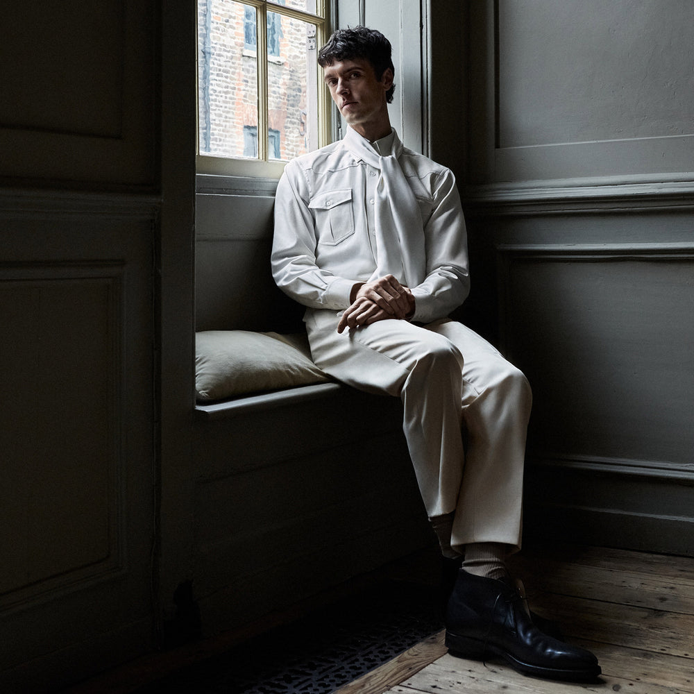 The Cream Cotton Weekend Fit Western Shirt with Dorset Collar by Turnbull & Asser features two chest pockets and is laid flat on a white background—ideal for smart-casual style.