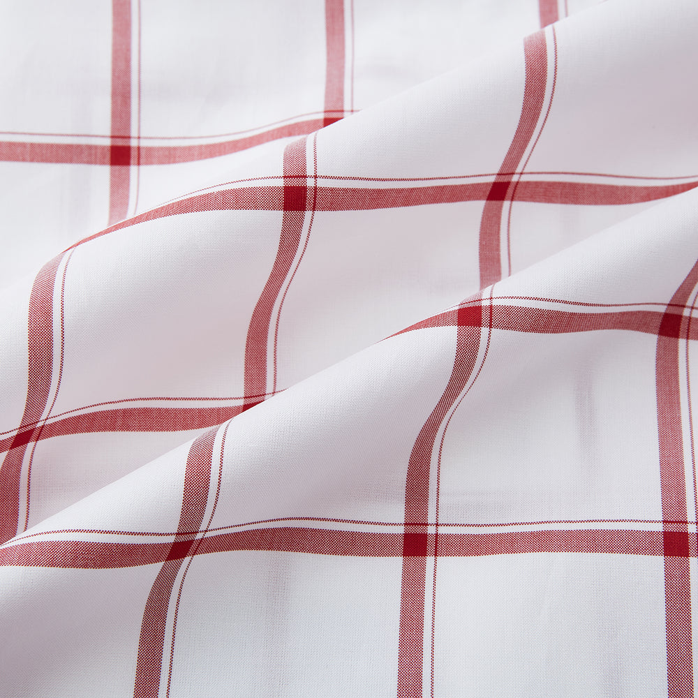 The Turnbull & Asser Dark Red Grid Check Mayfair Shirt is a long-sleeve white shirt made from Italian cotton, featuring a bold dark red grid pattern, button-down front, and classic collar, shown laid flat on a white background.