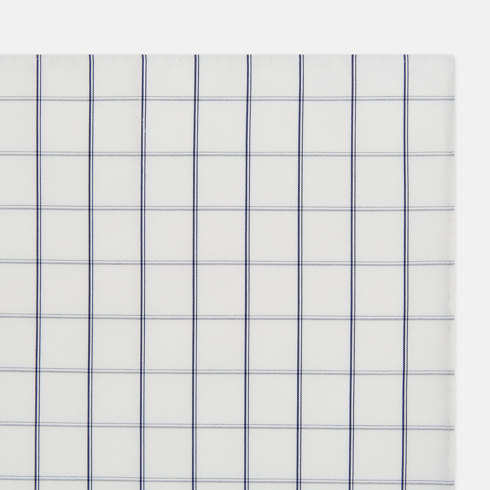 The Turnbull & Asser Dark Navy Double-Line Check Hand-Rolled Handkerchief features a white base with intersecting navy lines and hand-rolled edges, expertly crafted in England.